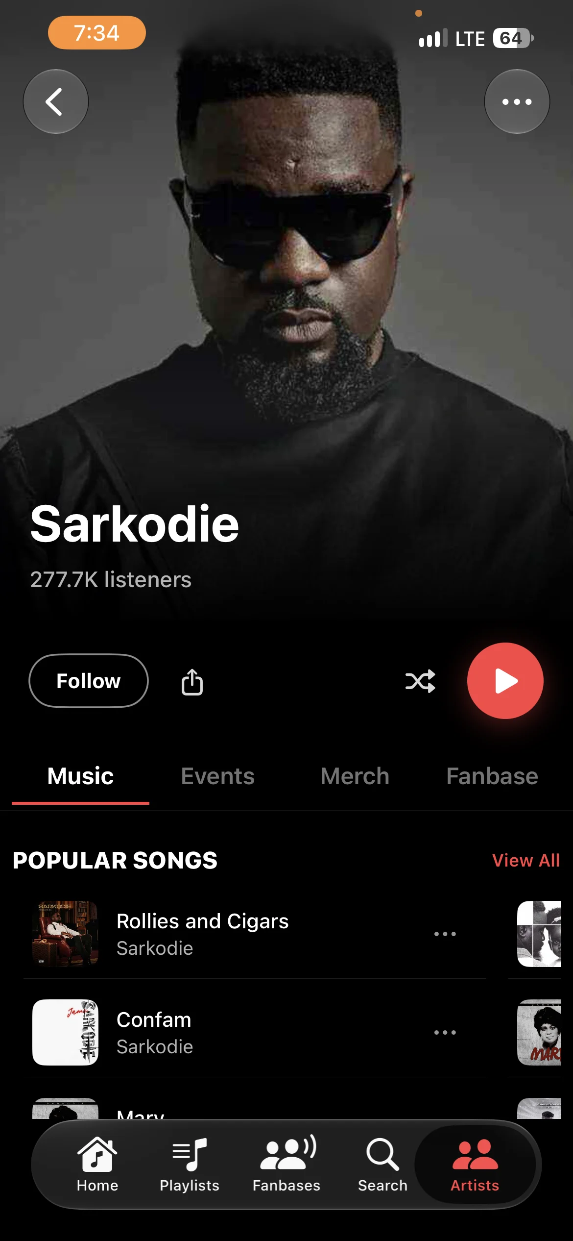 The live artist page for Sarkodie: a large photo header, Follow, shuffle and play, and his popular songs.